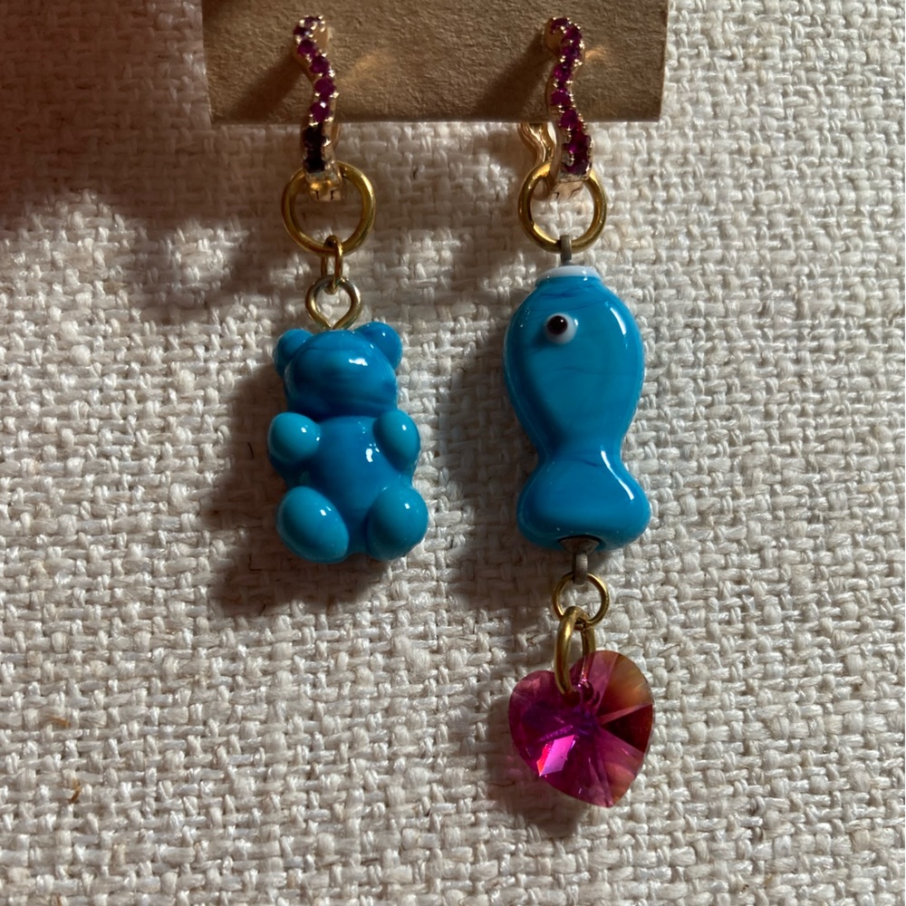Gold plated earrings with handmade glass gummy bear and fish charms.